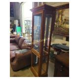 Wooden curio cabinet with glass doors and glass