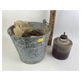 Galvanized bucket, rusty horse shoes