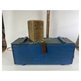 Blue wooden crate with leather straps, wood block