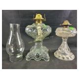 Hurricane  lamps with ornate bases one glass t