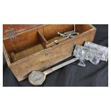 Wooden box with lead toy soldier molds, ladle,