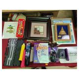 Framed art, assorted umbrellas, Fuji camera, Sony