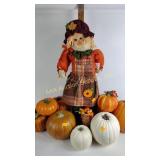Faux pumpkins, scarecrow autumn decor