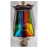 Bronzed lamp with stained glass shade
