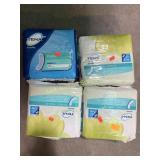 (4) packs of Tena women