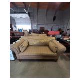 Gold colored sofa with pillows- 81"x41", 21" seat