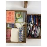 Office supplies including pens, index cards,