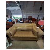 Gold colored sofa with pillows- 81"x41", 21" seat