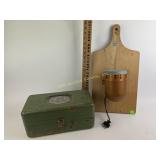 Green metal toolbox, vintage siren mounted on