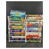 VHS tapes including beetlejuice, scooby-doo,