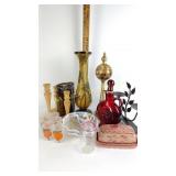 Red glass decanter, wooden candle sticks, hand