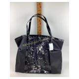 Black faux leather tote with animal print bottom,
