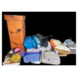 Wooden tall square trashcan. Teal sleeping bag.