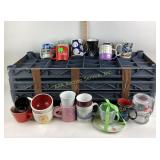 Approximately a dozen mugs or glasses all in very