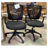 Two black wheeled office chairs.