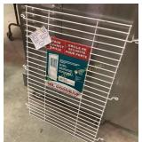 Metal door security grille measures 24x40in.