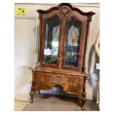 Renaissance style hutch curio cabinet, dark wood.