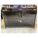 Metal, glass and wood entertainment center has