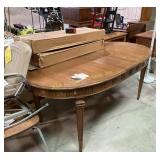 Wooden table with leaves carved pattern around