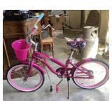 Ozone 500 hot pink island girl cruiser bike.