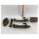 Vintage ice skates and cast iron press.
