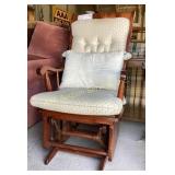 Dark brown glider rocker with cushions, creamed
