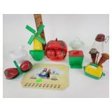 Salt and pepper shakers, one with lid missing.