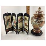 Asian style urn vase with lid and wooden base.