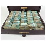 Assorted watch parts within four drawer metal