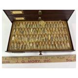 Assorted watch parts within four drawer metal