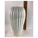 Tall white ripped decorative vase.