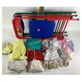 3 kids, foldable chairs, red and green. With