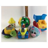 Care Bears crayon tin. fisher-Price dump truck.