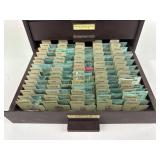 Assorted watch parts within four drawer metal