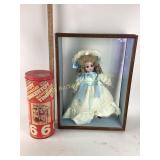 Tinker Toy construction set and porcelain doll