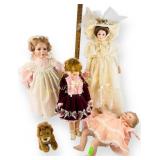 Four porcelain dolls, fair to good condition and