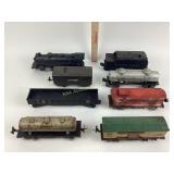 Various model train cars and locomotives. Mostly