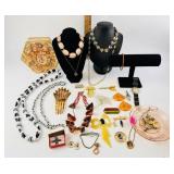 Celluloid hair pin with amber rhinestones.