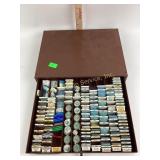 Single drawer metal case containing miscellaneous