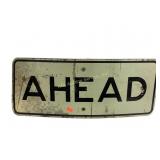 Metal Street sign that says Ahead.