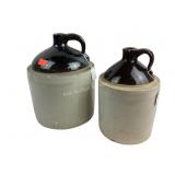 Two brown and gray crock jugs.