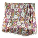 Bed coverlet with Pom poms around edge.