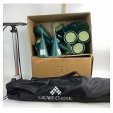 Camping chair, Schwinn, bike pump, and cemetery