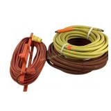 Orange extension cord, yellow garden hose, brown