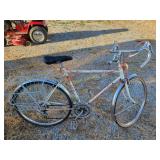 Huffy 12 bike with saddlebag style basket, rust