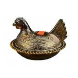 Amber glass hen on nest