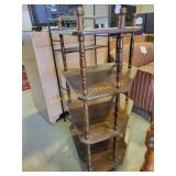 Three-tiered wooden corner shelf with turned