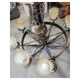 Antique wrought iron chandelier with six frosted