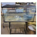 Large aquarium tank on a sturdy metal stand. T