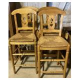 wooden bar stools with carved backrests and